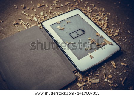 E-book and sawdust. (Battery low)