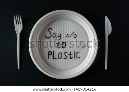 Concept of nature protection. Say no to plastics. Background. Prohibition of disposable tableware