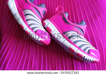 silver shoes on a bright background, a place for an inscription on the background near comfortable summer shoes