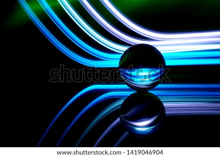 light painting behind a glass ball                               