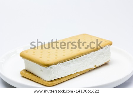 Ice cream sundae sandwich on plate with white background