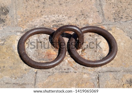rings for mooring yachts and ships. Fixing mooring knot on the pier.