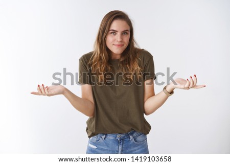 So what not care. Portrait unbothered chill relaxed clueless charming female shrugging hands spread sideways unaware, questioned smiling apologizing unknow answer, standing white background