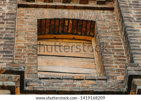 texture of old brick wall and wooden planks