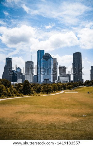 Downtown Houston Texas skyline, daytime, blue skies.