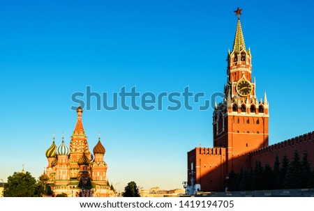 Moscow Kremlin and St Basil's Cathedral on Red Square in sunset time, Russia. Old Kremlin is a top tourist attraction of Moscow. Beautiful sunny view of the famous Moscow landmarks. Travel concept.