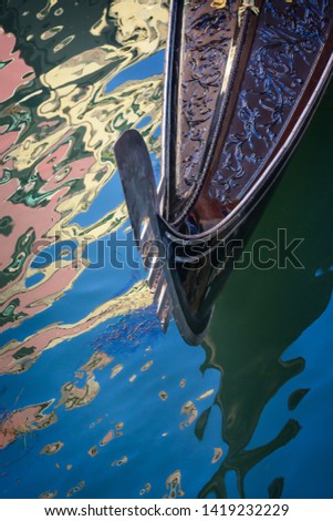 Nose of the Venetian gondola against the background of water