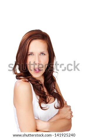 Portrait of a woman with tongue out and arms crossed