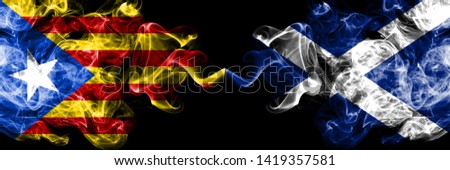 Catalonia vs Scotland, Scottish smoke flags placed side by side. Thick colored silky smoke flags of Catalonia and Scotland, Scottish