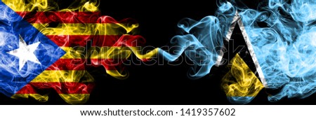 Catalonia vs Saint Lucia smoke flags placed side by side. Thick colored silky smoke flags of Catalonia and Saint Lucia