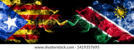 Catalonia vs Namibia, Namibian smoke flags placed side by side. Thick colored silky smoke flags of Catalonia and Namibia, Namibian
