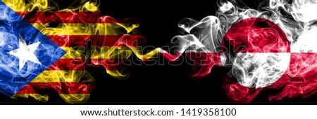 Catalonia vs Greenland smoke flags placed side by side. Thick colored silky smoke flags of Catalonia and Greenland