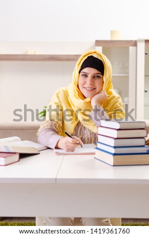 Female student in hijab preparing for exams 