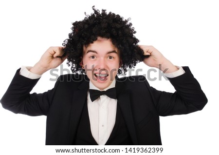 Young man wearing afro wig