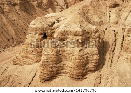 Qumran caves in Qumran National Park, Israel Royalty-Free Stock Photo #141936736