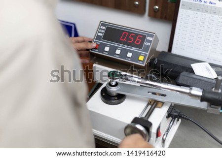 Torque Wrench Calibration with precise calibration machine Royalty-Free Stock Photo #1419416420