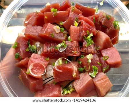 Fresh tuna fish sashimi on rice on plastic bowl