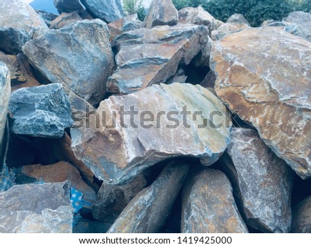 Stones/Rocks pilings. Important material found in mountainous country Nepal for building the walls and pavements. 