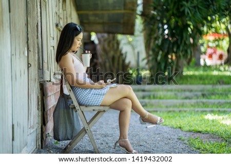 The picture of asian women drinking ice coffee