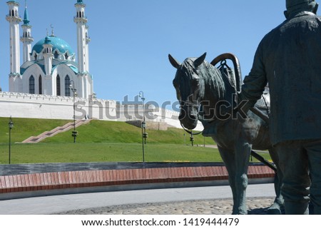 Kremlin Kazan statue Asgata Galimzyanovicha Galimzyanova  against the background mosque Tatarstan tourism
