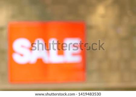 Blurred sale labels for the background