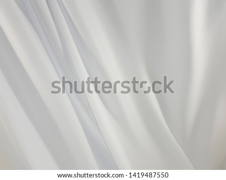 White satin fabric closes All background.