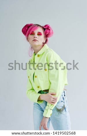 woman with pink hair with makeup