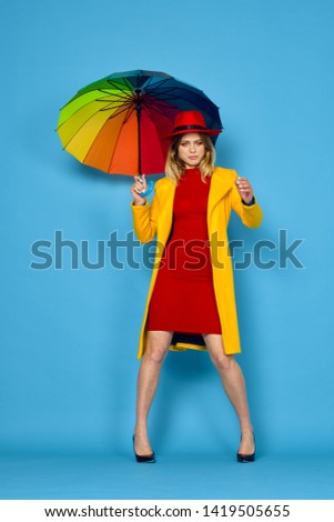  woman holding a beautiful umbrella in the rain                              