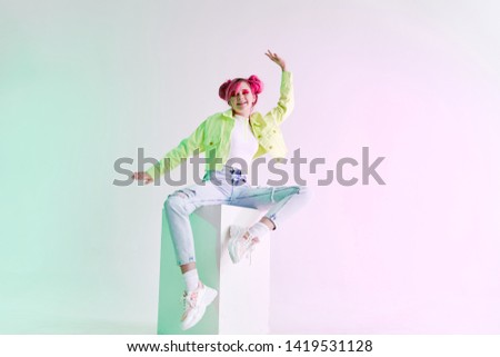 woman with pink hair sits on a cube place free