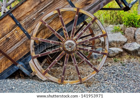 oil painting antique wood cart with big wheels on harvest. Oil photshop filter