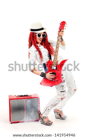 Modern girl rock musician is playing the electric guitar. Isolated over white.