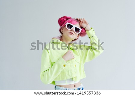 woman with pink hair with glasses