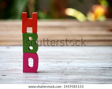 Wood letter in word HBD (Abbreviation of happy birthday) on wood table