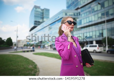 Young beautiful business woman talking on the phone. Business concept                   