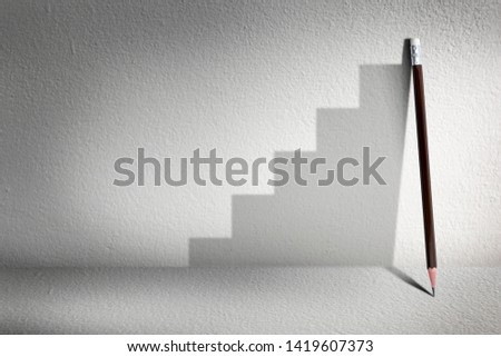 Stairs with pencil for effort and challenge in business to be achievement and successful concept.
 Royalty-Free Stock Photo #1419607373