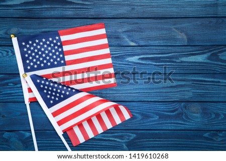 American flags on blue wooden table