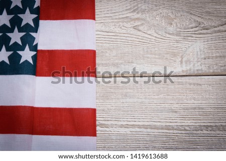 American flag on a wooden background. The concept of freedom and patriotism