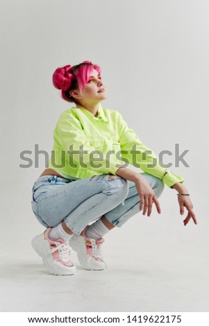 woman crouched fashion style pink hair