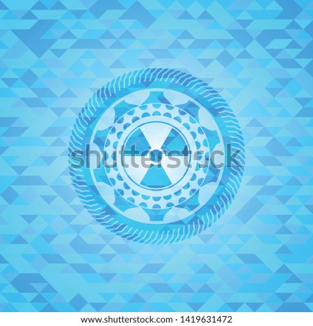 nuclear, radioactive icon inside realistic light blue emblem. Mosaic background