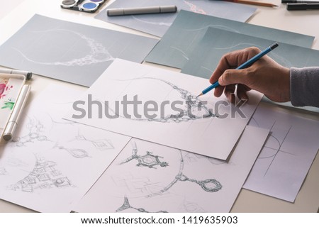 Designer design diamond jewelry drawing sketches making works craft unique handmade luxury necklaces product ideas. Royalty-Free Stock Photo #1419635903
