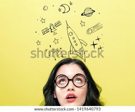 Dream of space and rocket with young woman wearing eye glasses