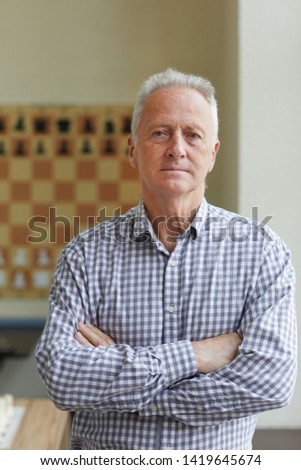 Experienced professional grandmaster posing for pictures for his book about playing chess