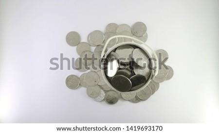 coin on the white bucket isolated on white bacground