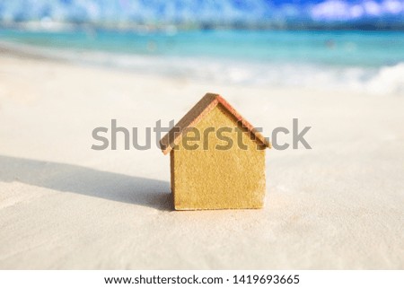 Photo Of Miniature House Model On Sandy Beach
