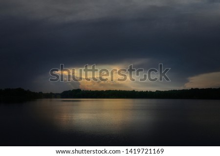Dark ramatic clouds and river