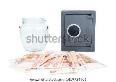 Russian rouble. the money is in a glass jar. five thousand ruble on white background, safe on white background