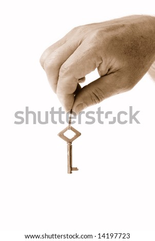 House sale concepts - key on men hand.