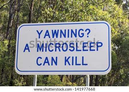 Yawning? A microsleep can kill - road sign in Victoria, Australia Royalty-Free Stock Photo #141977668