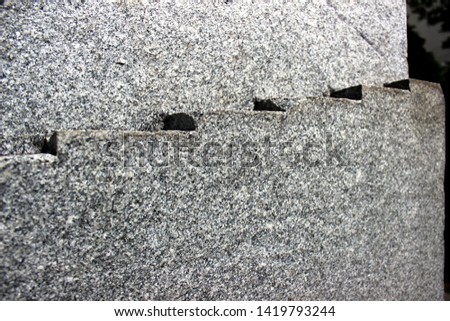 Gravel pebbles natural stone wall decorative texture pattern background.