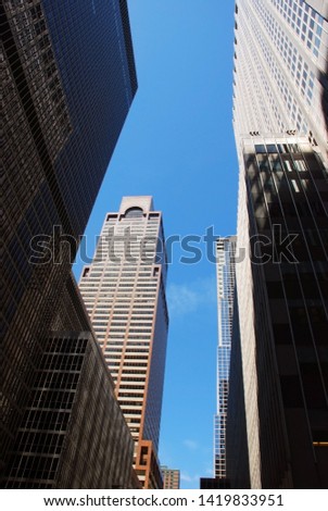 modern buildings in new york city on a clear blue sky